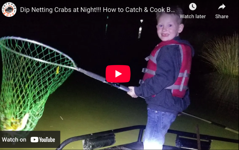 Child holding a dip net with text about catching crabs at night on a YouTube video interface.